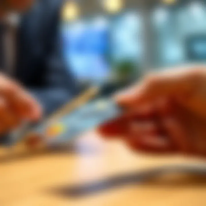 Business Transaction with Credit Card A close-up of a credit card being used for a business transaction